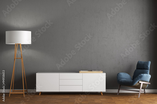 Sessel, Sideboard und Stehlampe vor grauer Wand photo