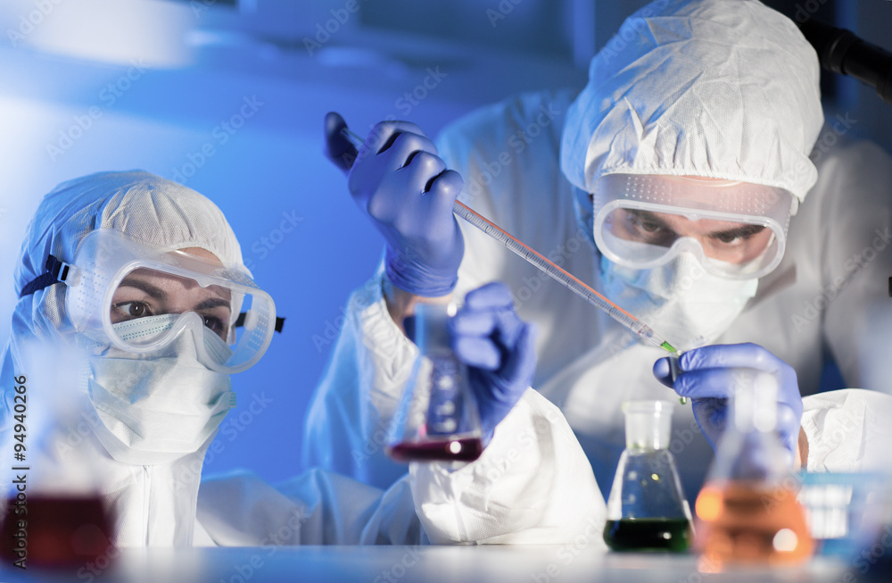 close up of scientists making test in lab close up of scientists making test in lab
