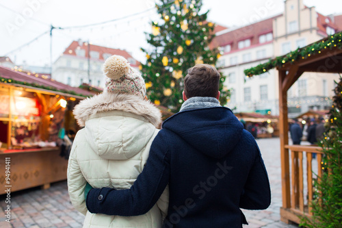 close up of couple in old town at christmas