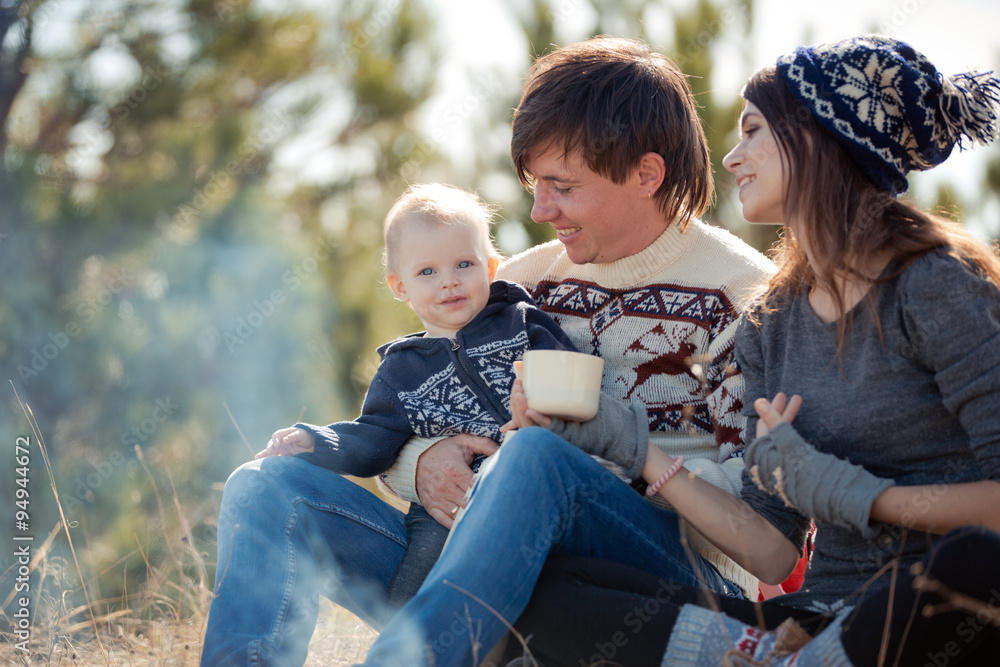 Family resting in autumn forest Family resting in autumn forest