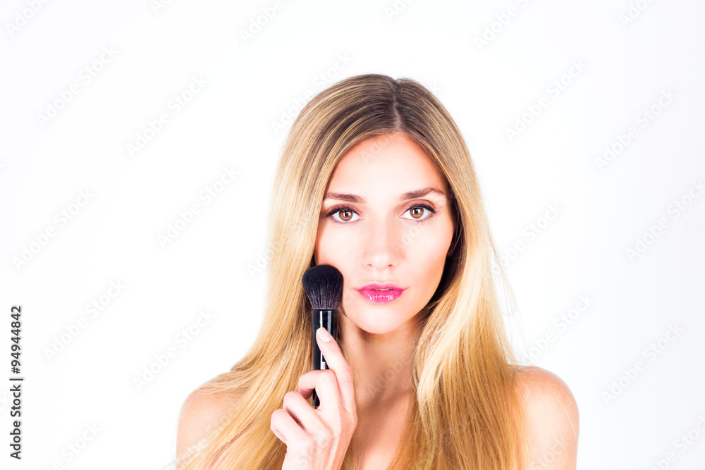 Woman with make-up and brush for rouge Woman with make-up and brush for rouge