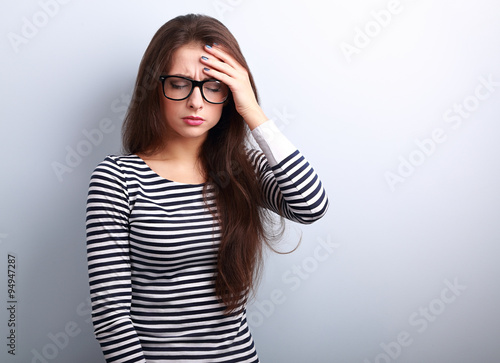 Obraz na plátně Beautiful business woman with headache holding head the hand wit