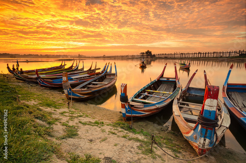 Wooden boat in Ubein Bridge at sunrise  Mandalay  Myanmar  World longest wooden bridge 