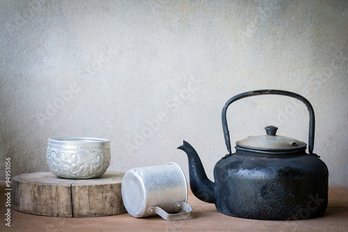 Still life. Old aluminium kettle and cup old thai style retro on