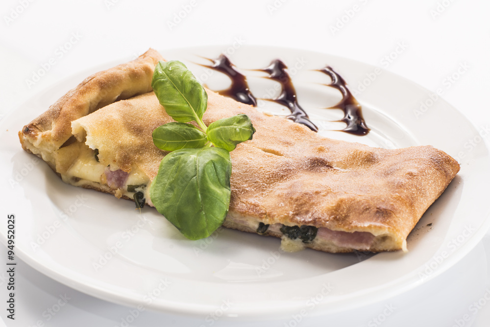 Pizza calzone on white background