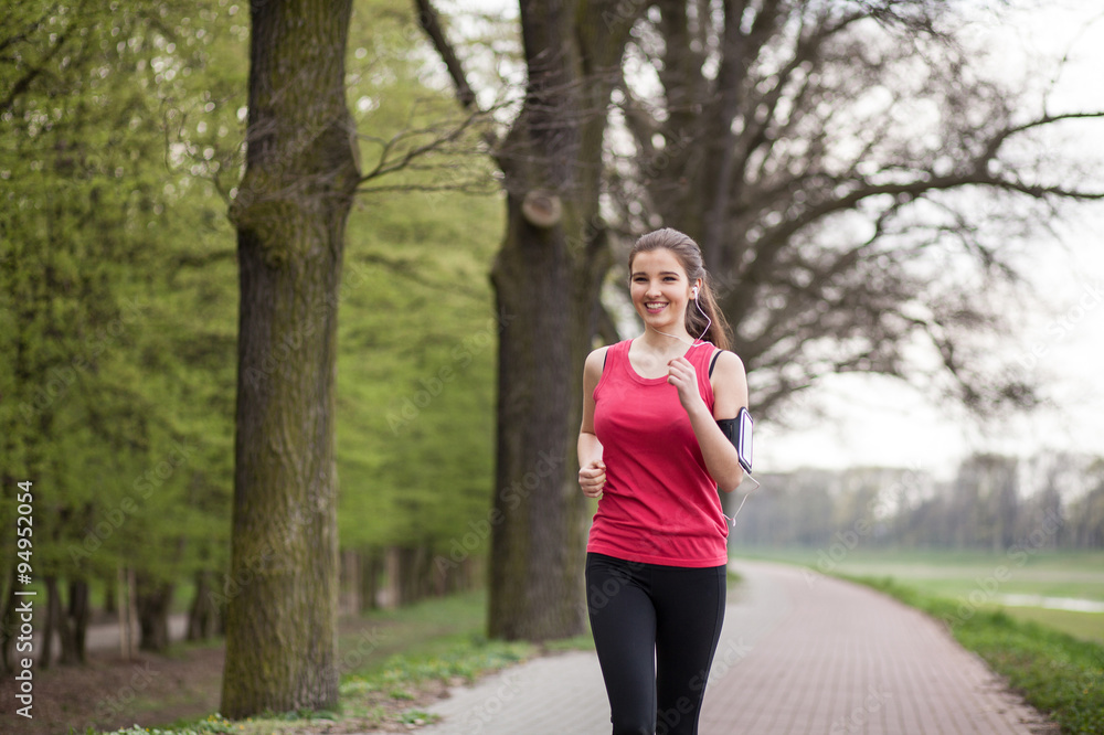Young beautiful woman running in the city Young beautiful woman running in the city