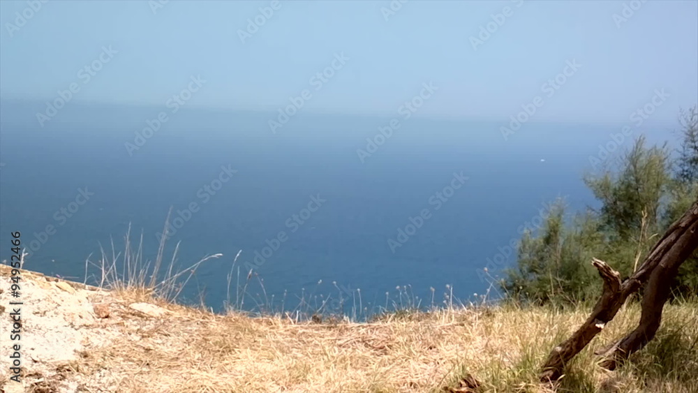 Sea views and city with high mountains, overgrown with grass and trees Sea views and city with high mountains, overgrown with grass and trees