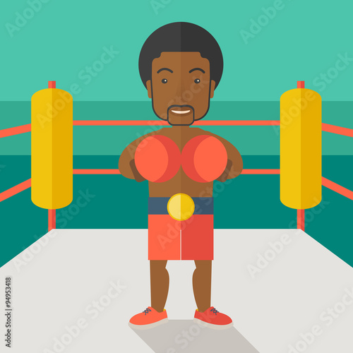 Boxer in gloves standing in ring.