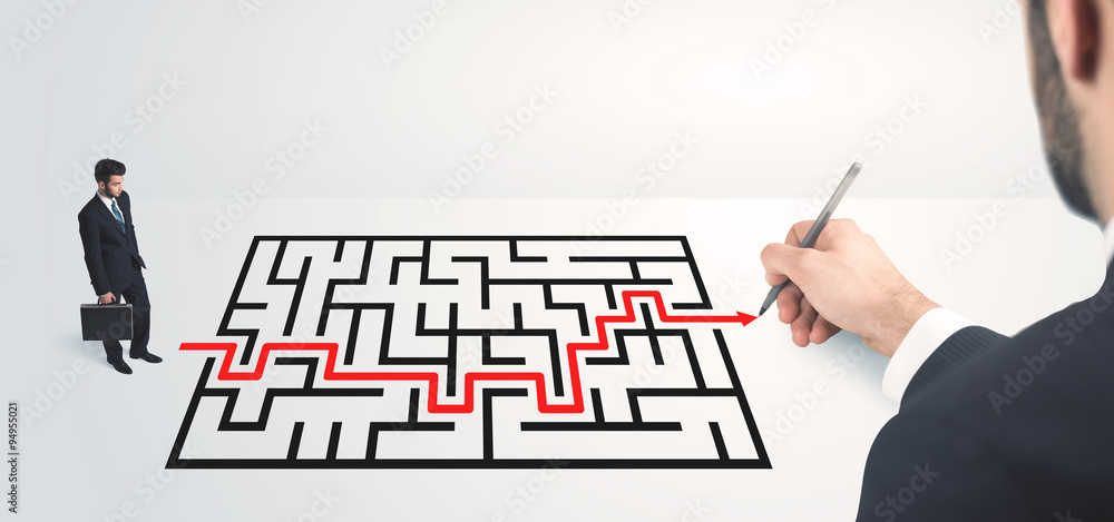 Business man looking at hand drawing solution Business man looking at hand drawing solution