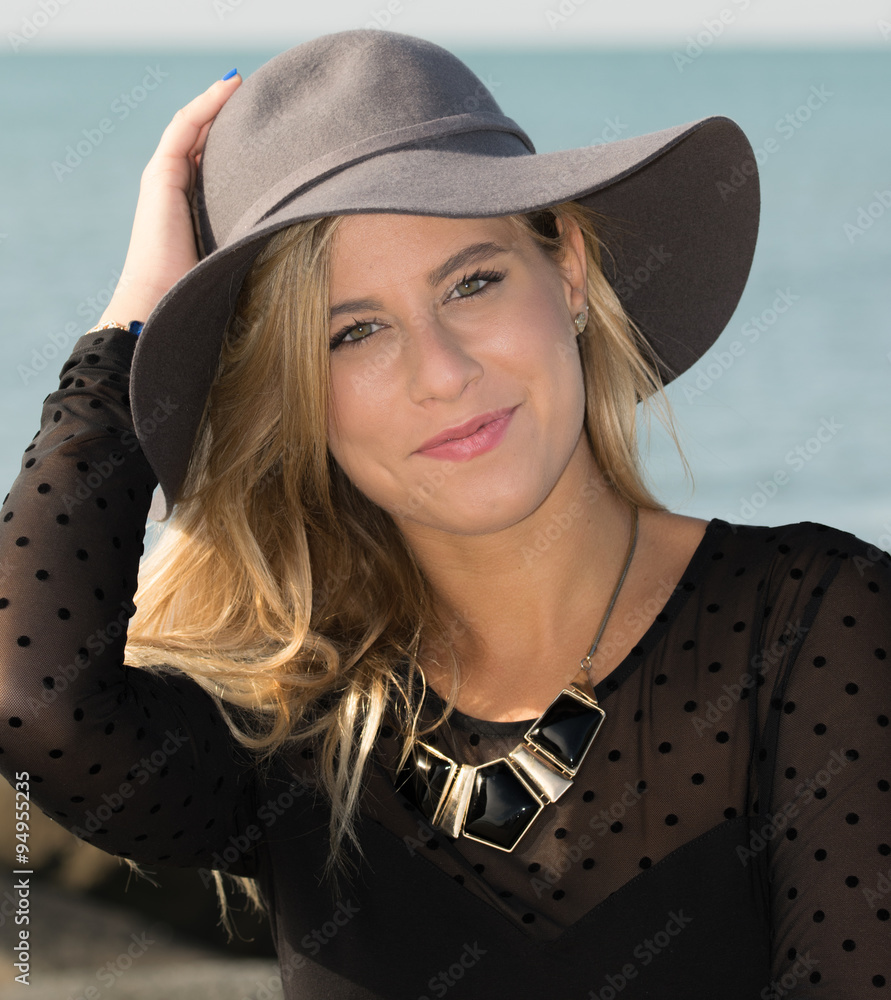 Girl with gray hat foto de Stock Adobe Stock