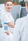 Smiling woman working in lab