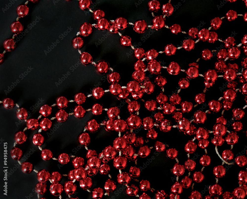 Red Christmas beads black background