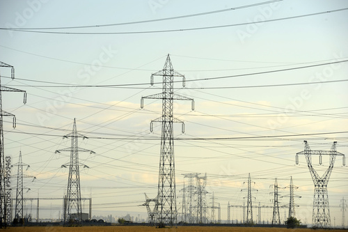 Electricity pylons on the field - daytime shot
