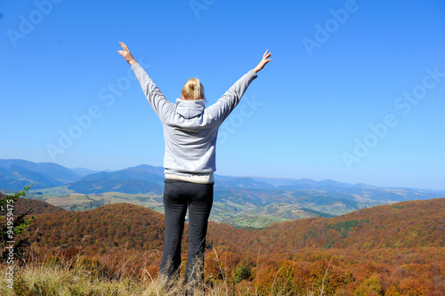 Woman in autumn mountain