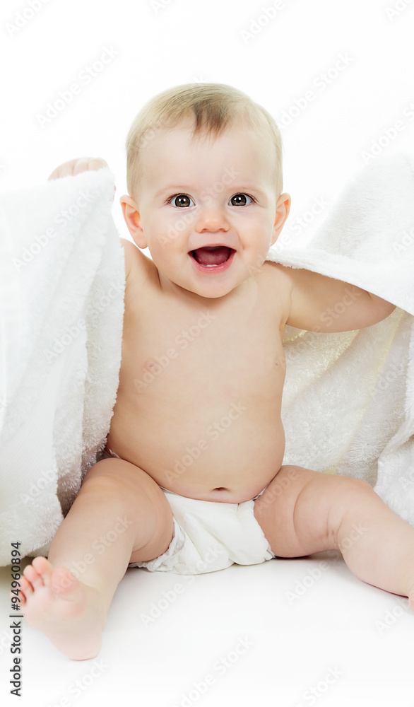 Sweet little boy sitting on studio white background