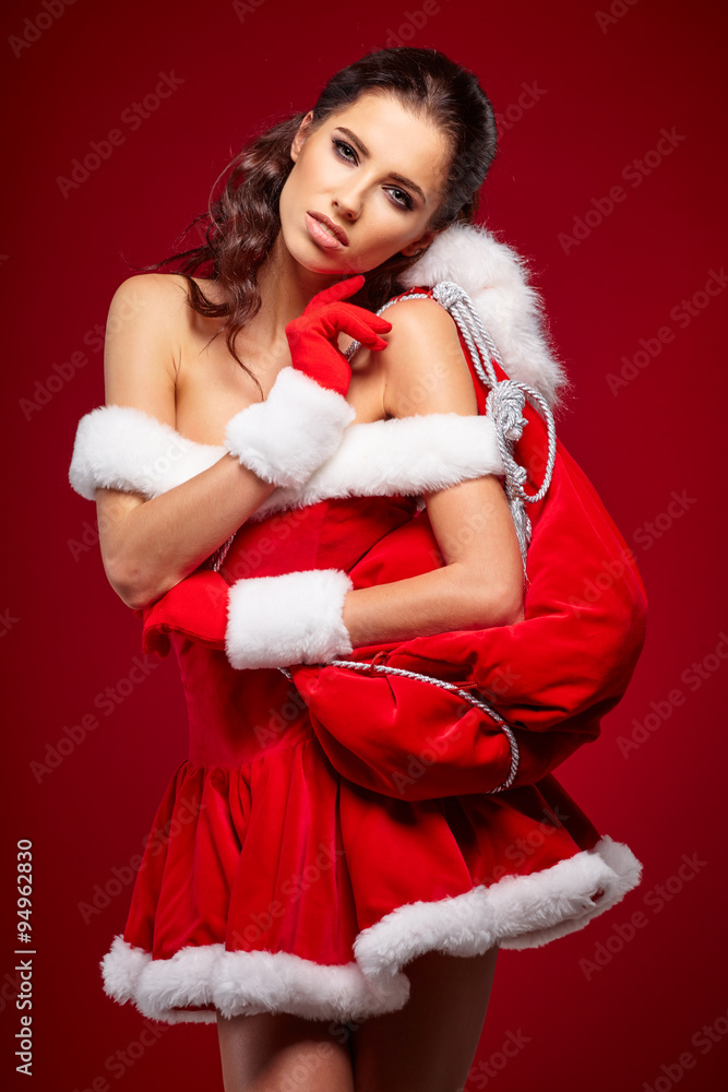 Portrait of beautiful sexy girl wearing santa claus clothes Portrait of beautiful sexy girl wearing santa claus clothes