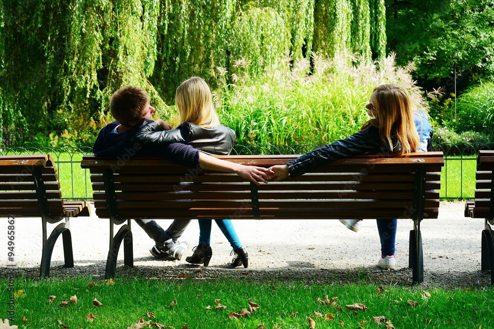 Love triangle in Vilnius town Bernardinu garden on autumn