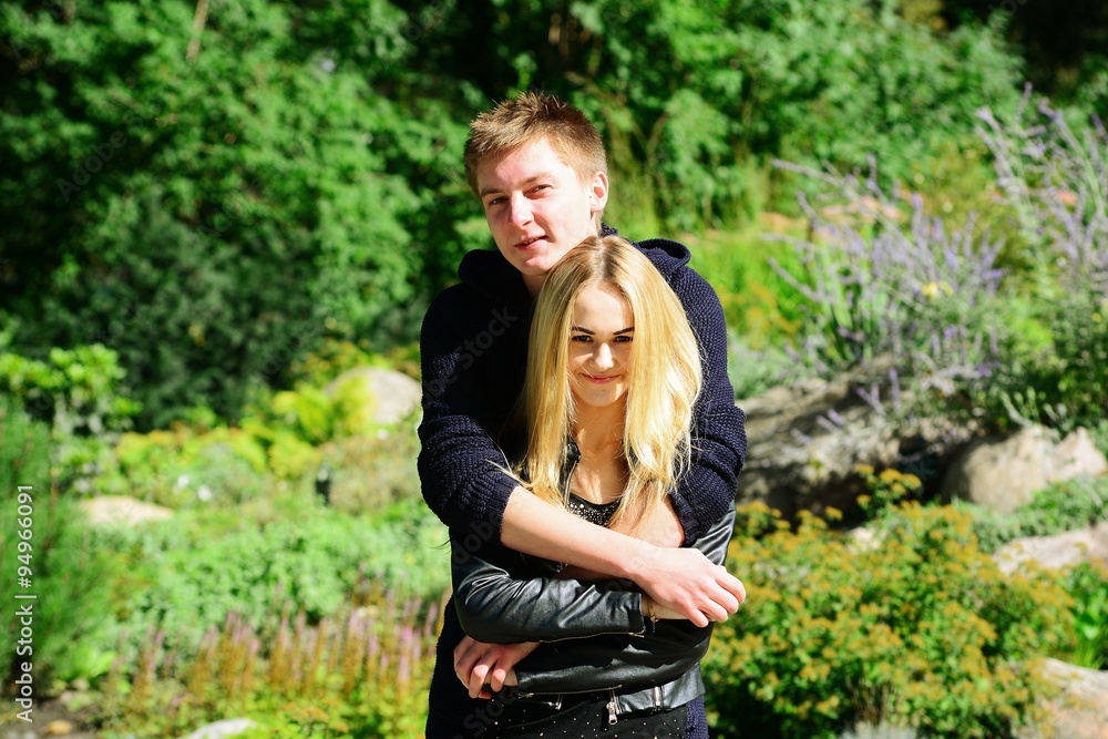 Young couple in Vilnius town Bernardinu garden on autumn