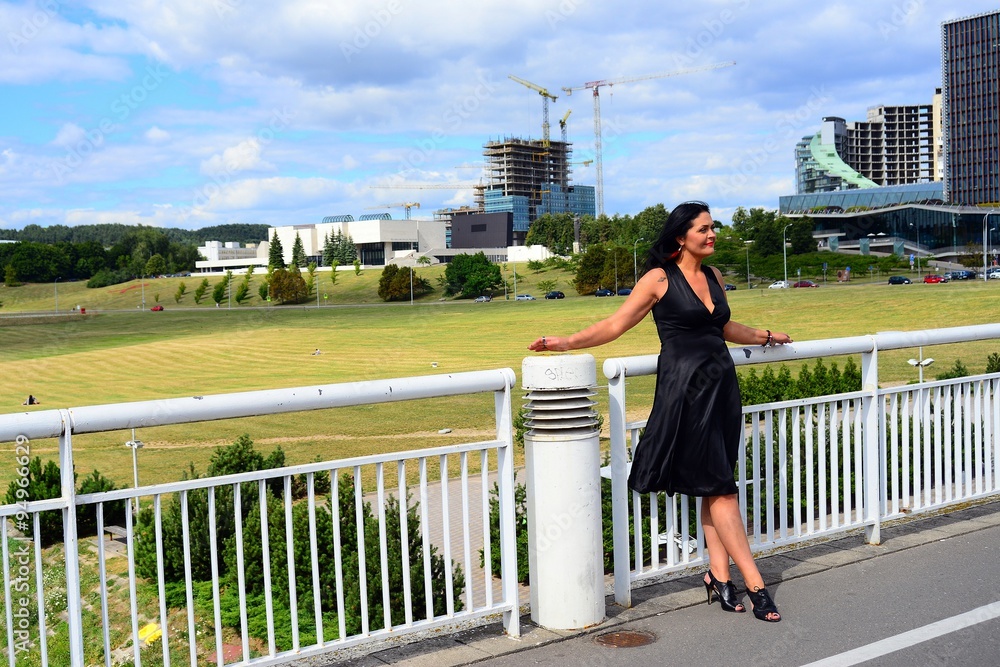 Woman in black on the bridge in Vilnius town