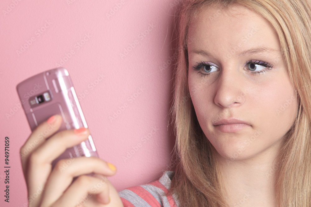 Teenage girl use cellphone in her room. Teenage girl use cellphone in her room.