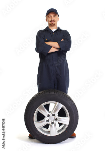 Car mechanic with a tire.