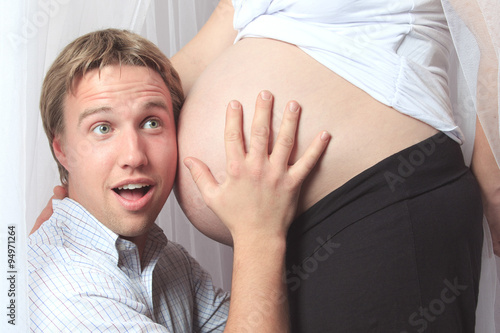 pregnant woman with his boyfriend on the baby room