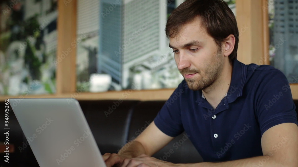 man typing at a laptop man typing at a laptop