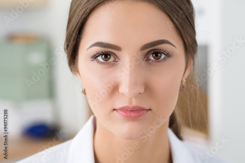Close-up portrait of young serious medicine doctor