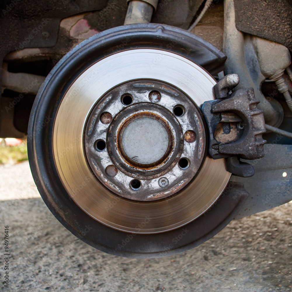 Disc brake detailed closeup in mechanic repair shop Disc brake detailed closeup in mechanic repair shop