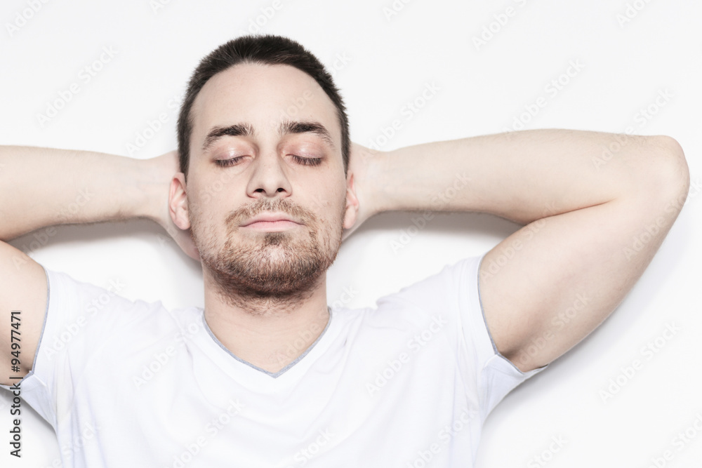 Obraz premium A relax man over a studio white background