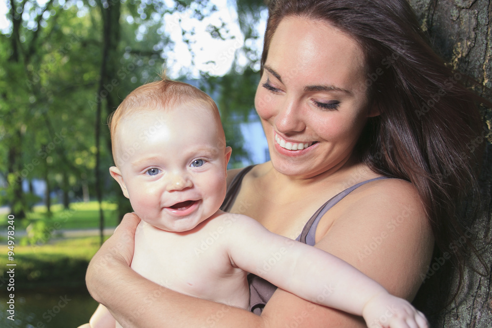 mother with is baby on a beautiful forest mother with is baby on a beautiful forest