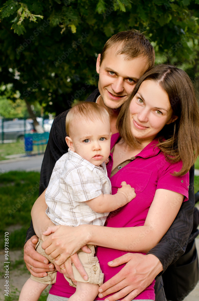 Obraz premium young happy family in summer outdoors