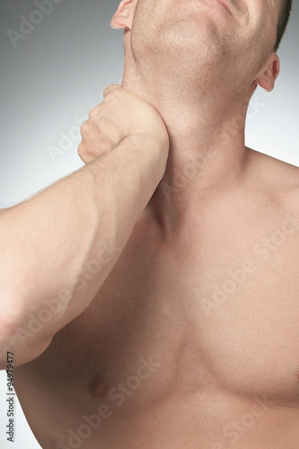 Young man with neck pain
