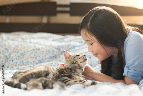 Photography Beautiful asian girl kissing american shorthair cat