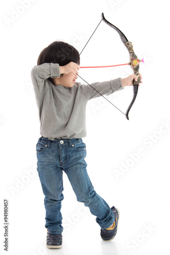 Cute asian boy playing toy bow