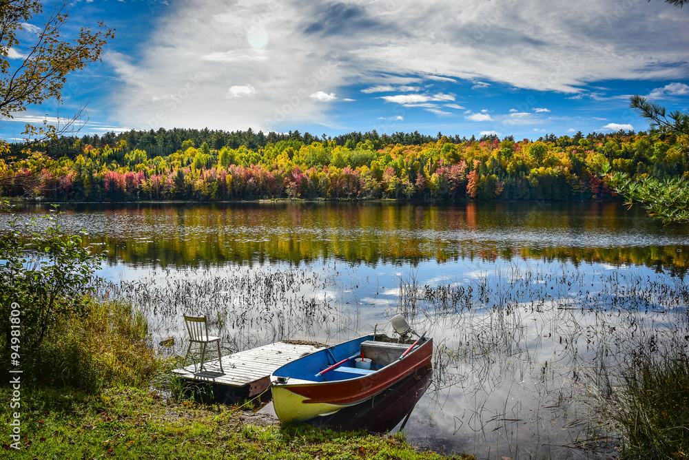 A fishing boat rests on the shore in late September on the Lake.