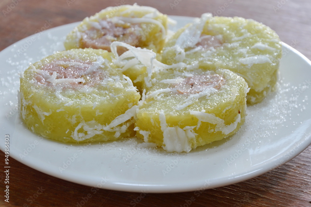 glutinous rice wrapped in banana topping sugar glutinous rice wrapped in banana topping sugar