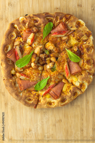 Hot Pizza with Pineapple, Ham and Bell Pepper Top View with copy