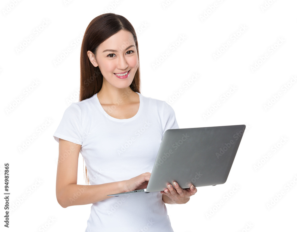 Asian Young Woman use of the notebook computer Asian Young Woman use of the notebook computer