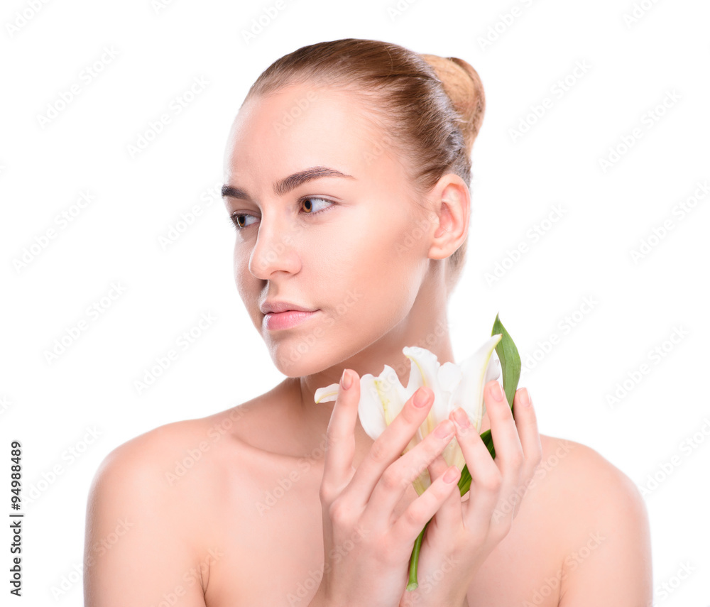 Beauty of health young woman posing with lily looking at the side. Beauty of health young woman posing with lily looking at the side.