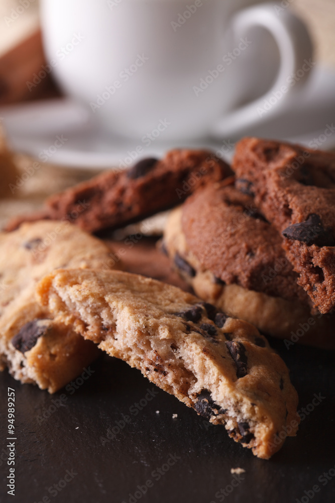 Chocolate chip cookies macro on a background of the cup. Vertical
Chocolate chip cookies macro on a background of the cup. Vertical