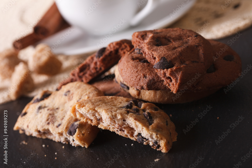 Fototapeta premium Chocolate chip cookies macro on a background of the cup. horizontal 