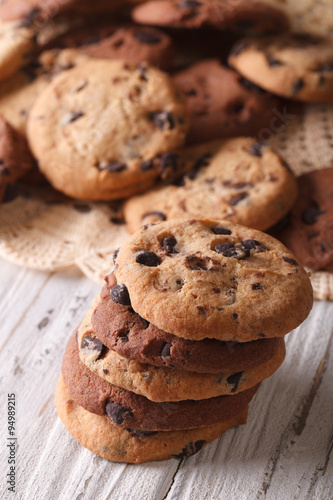 stack of chocolate chips cookies macro on a table. Vertical
