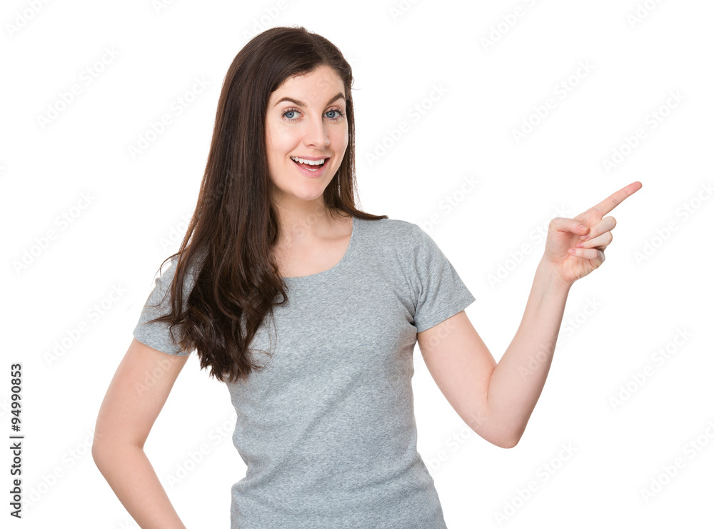 Caucasian woman with finger point aside Caucasian woman with finger point aside
