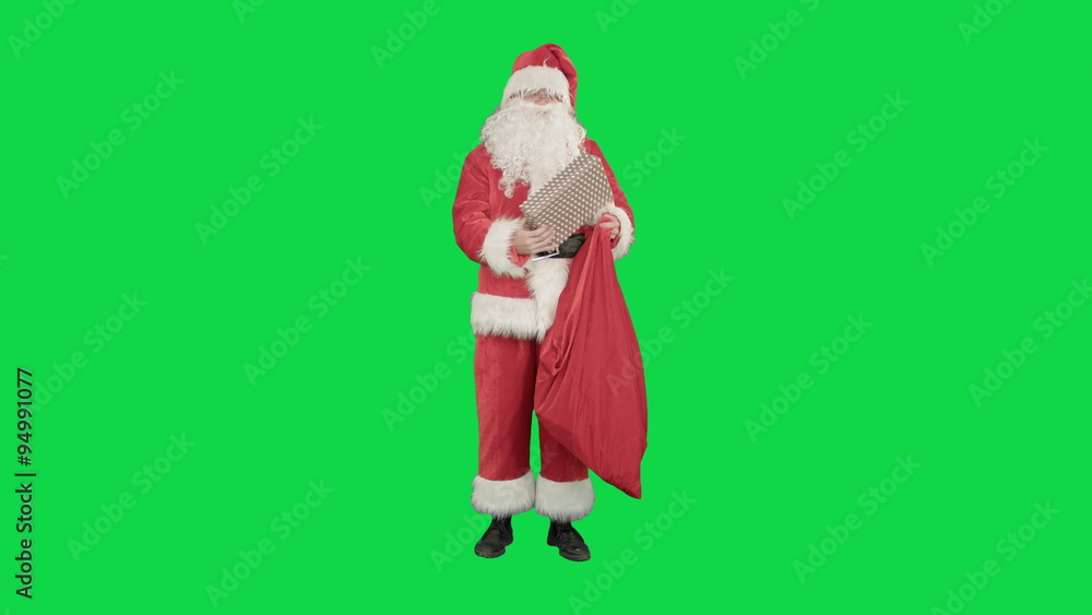 Santa Claus with his sack of lots of presents on a Green Screen Chrome Key Santa Claus with his sack of lots of presents on a Green Screen Chrome Key