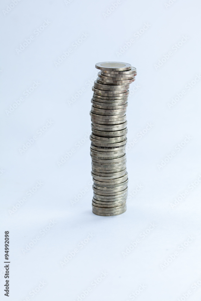 Group of coins stacking up in white isolated background. Group of coins stacking up in white isolated background.
