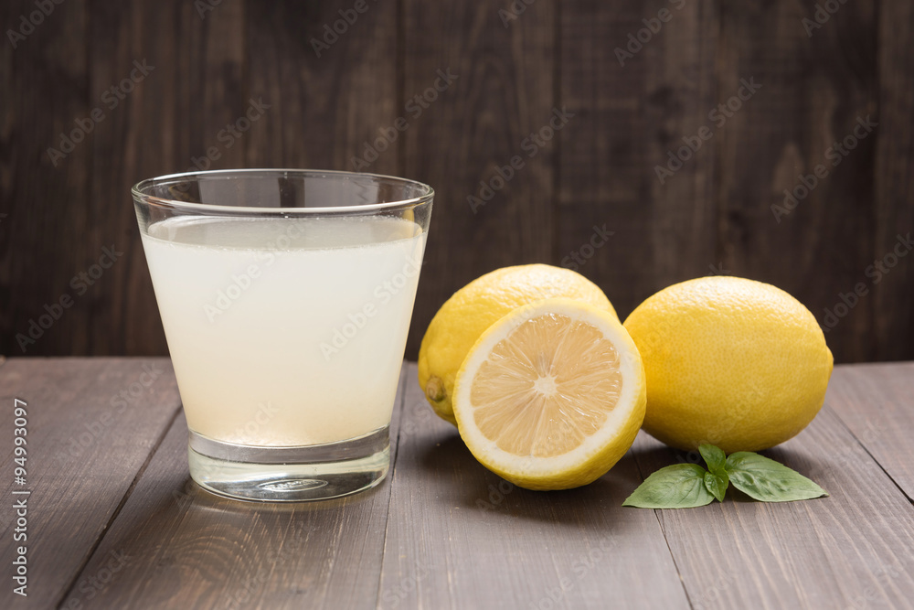 lemonade with fresh slice lemon on wooden table lemonade with fresh slice lemon on wooden table