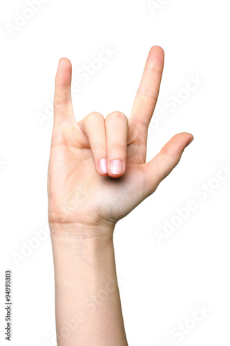 Hand giving the devil horns gesture on a white isolated background