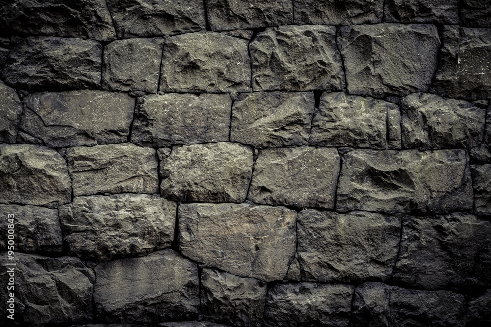 Background texture with rough wall of stone blocks Background texture with rough wall of stone blocks
