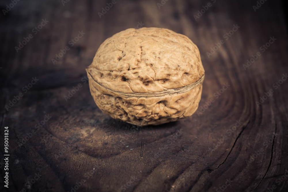 Walnuts on a wooden table. Walnuts on a wooden table.